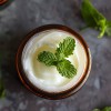 A jar of Peppermint Foot Rub Cream open
